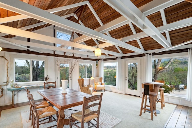 sunroom with lofted ceiling with beams