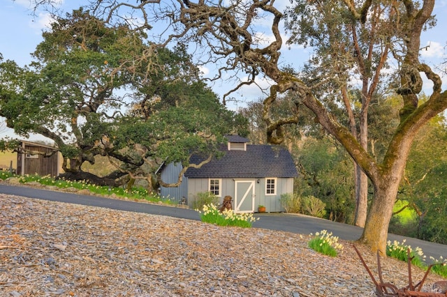 view of front of house with an outbuilding