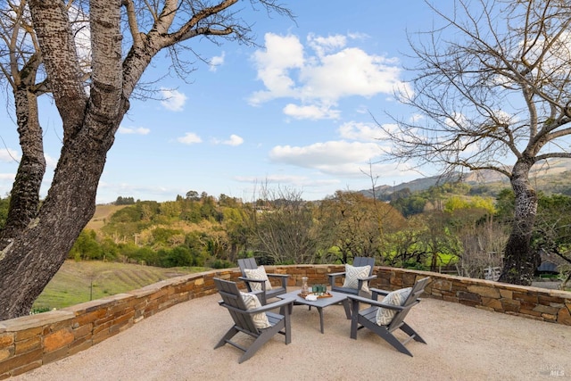 view of patio / terrace with an outdoor fire pit