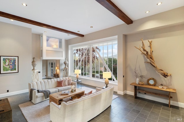 living room featuring beamed ceiling