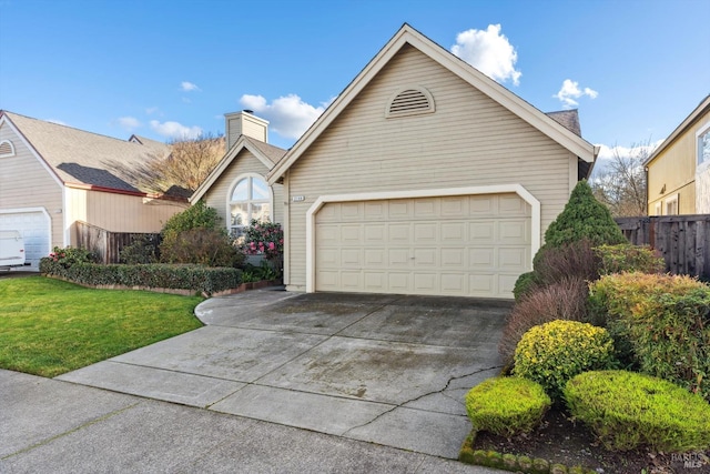 view of front facade featuring a garage and a front lawn