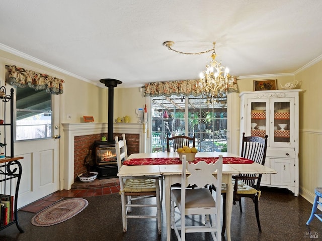 dining room with crown molding and a wood stove