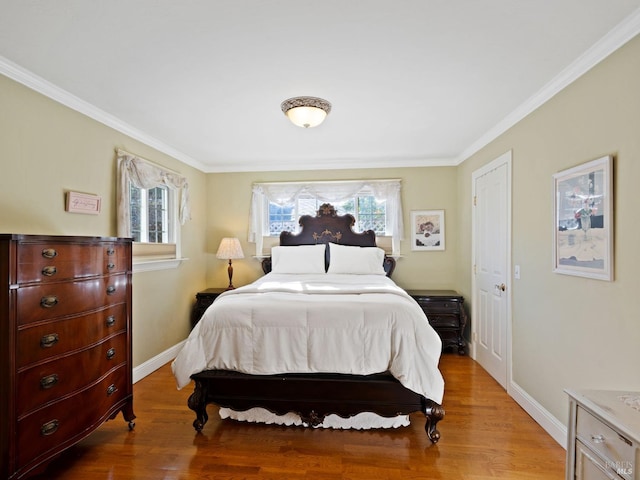 bedroom with crown molding and wood-type flooring