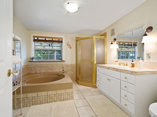 bathroom featuring tile patterned floors, vanity, and independent shower and bath