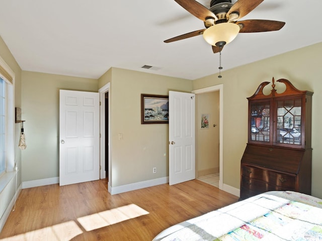 bedroom featuring ceiling fan and light hardwood / wood-style flooring