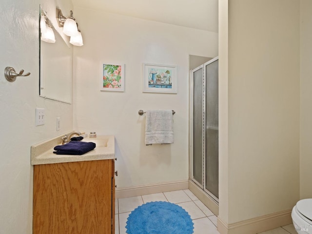 bathroom with walk in shower, tile patterned floors, vanity, and toilet