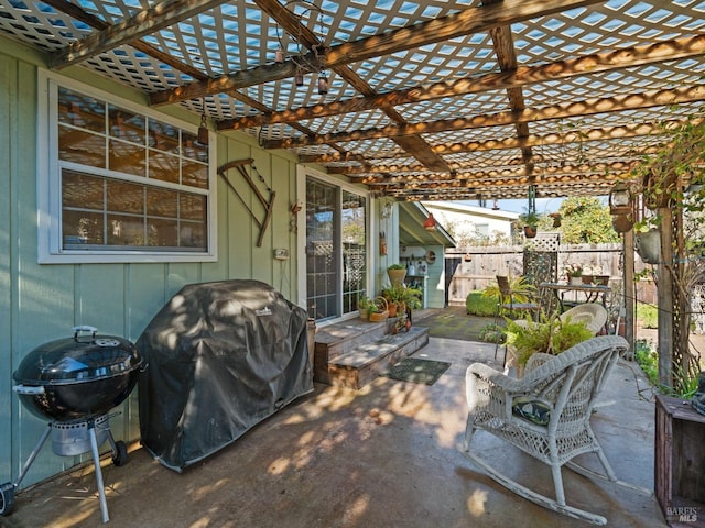 view of patio / terrace featuring area for grilling and a pergola