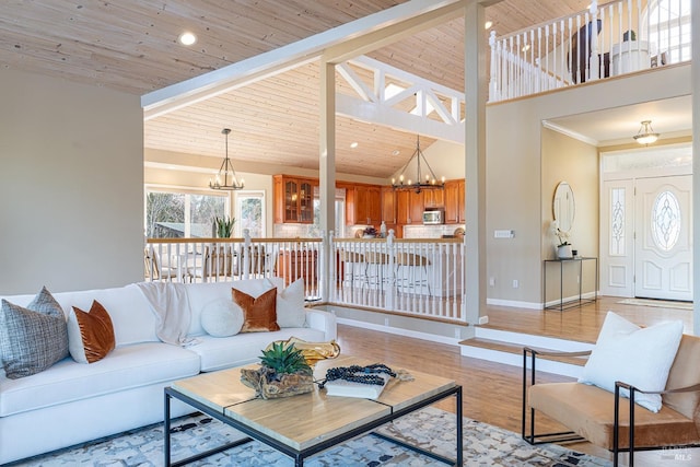 living room featuring wooden ceiling, light wood-style flooring, high vaulted ceiling, and a notable chandelier