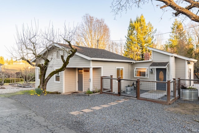 view of front of house with roof with shingles