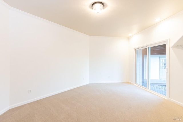 unfurnished room with recessed lighting, light colored carpet, crown molding, and baseboards