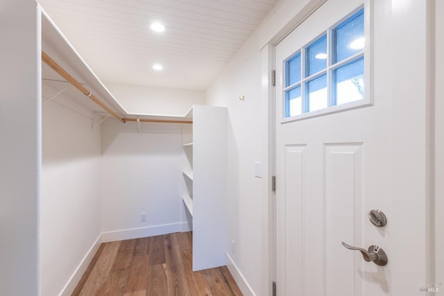 spacious closet with wood finished floors