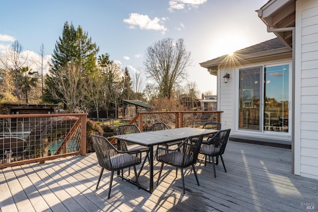 wooden deck with outdoor dining space