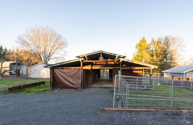 view of front of house with an outbuilding and an exterior structure