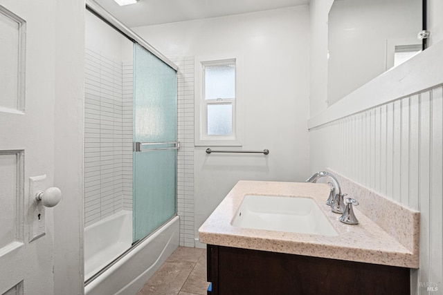 bathroom with vanity, bath / shower combo with glass door, and tile patterned floors