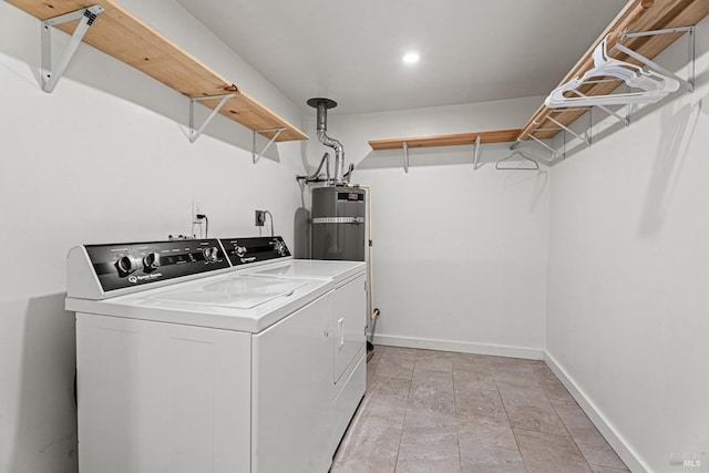 washroom featuring gas water heater and separate washer and dryer