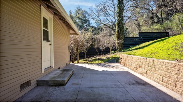 exterior space featuring a patio area and a lawn