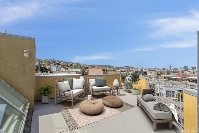 view of patio / terrace with a balcony and an outdoor hangout area