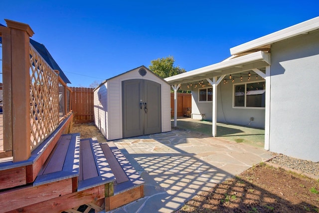 view of patio / terrace featuring a storage unit