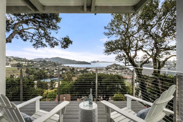 balcony with a water and mountain view