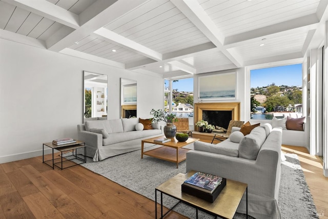 living room with hardwood / wood-style flooring, coffered ceiling, and beam ceiling