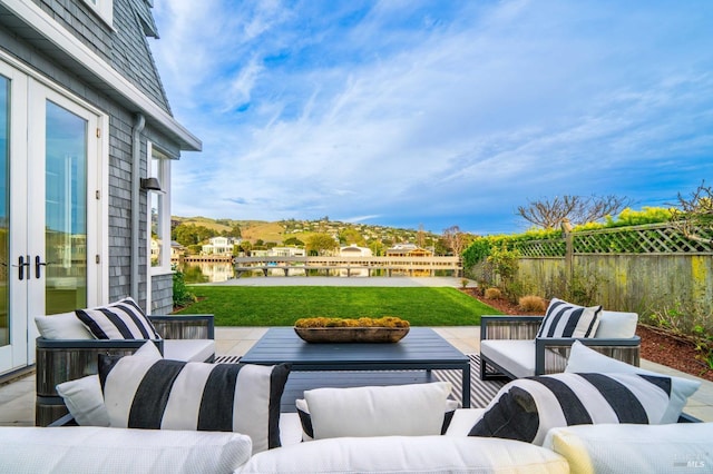 view of patio featuring an outdoor living space and fence