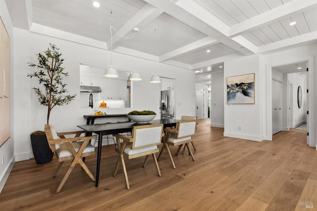 dining area with wood ceiling, beam ceiling, and light hardwood / wood-style floors