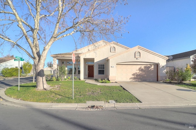 view of front of home with a garage and a front yard