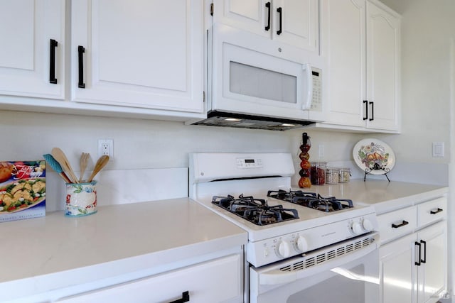 kitchen with white cabinets and white appliances