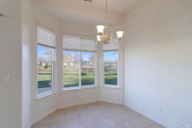 unfurnished dining area featuring light tile patterned floors and a notable chandelier