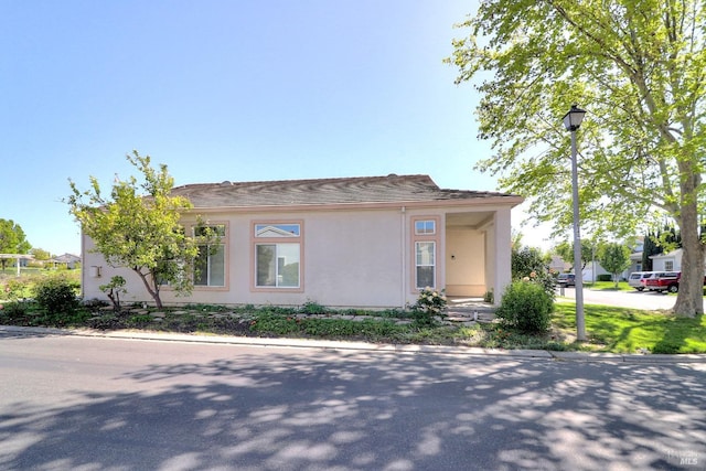 mediterranean / spanish house featuring stucco siding