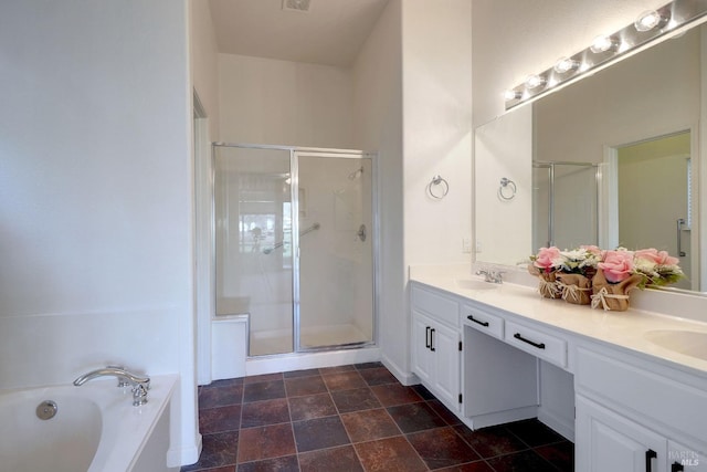 bathroom with vanity and separate shower and tub