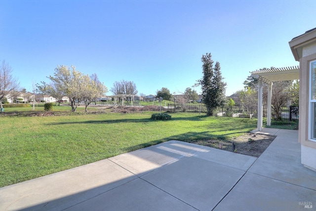 view of patio featuring a pergola and fence