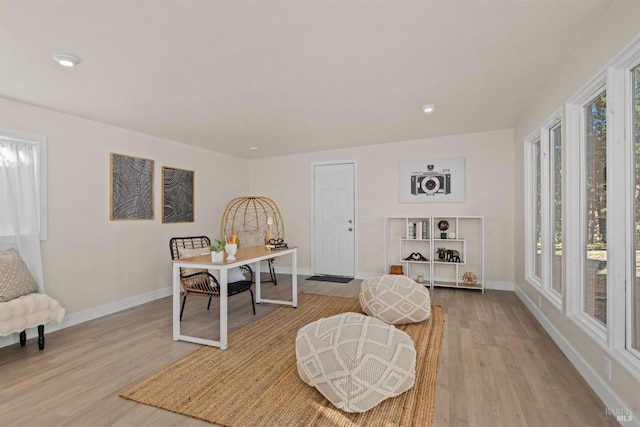 interior space with light wood-style floors, baseboards, and recessed lighting