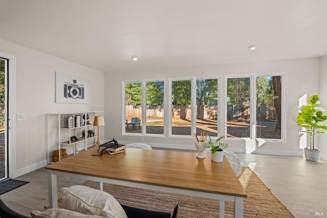 office area featuring baseboards and wood finished floors