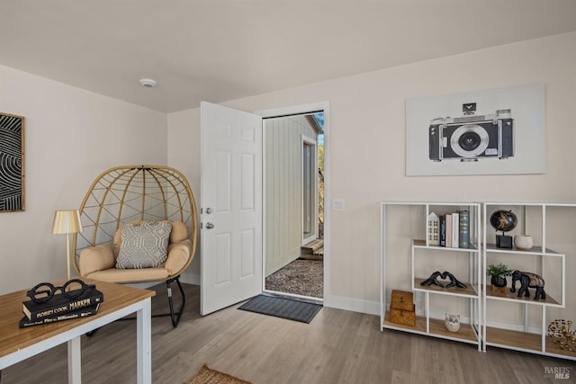 entrance foyer with wood finished floors and baseboards