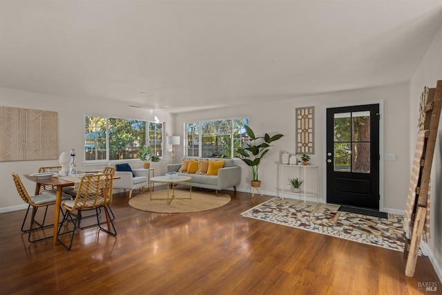 entryway with baseboards and wood finished floors