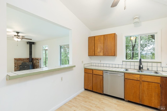 kitchen with ceiling fan, light hardwood / wood-style floors, dishwasher, and sink