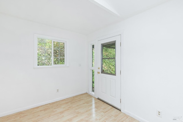 spare room featuring light hardwood / wood-style floors