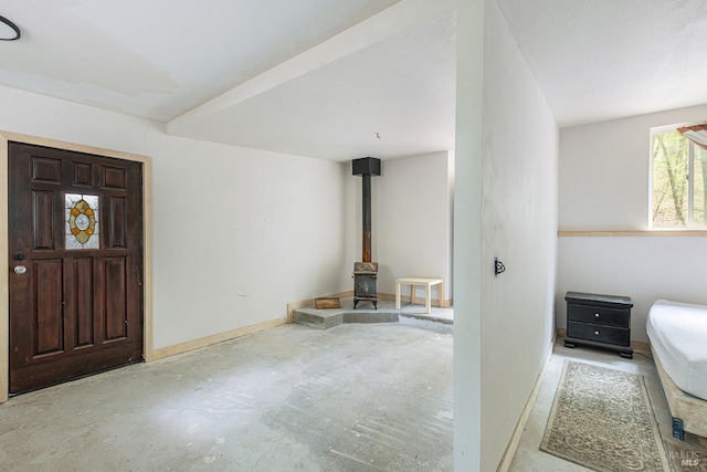 entrance foyer with a wood stove