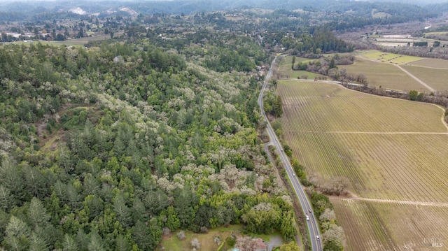 birds eye view of property with a rural view