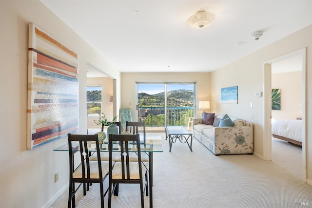 dining area with light colored carpet