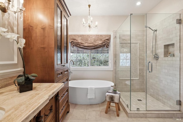 bathroom with vanity, plus walk in shower, and a chandelier