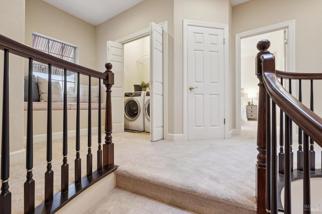 interior space featuring washing machine and dryer and carpet