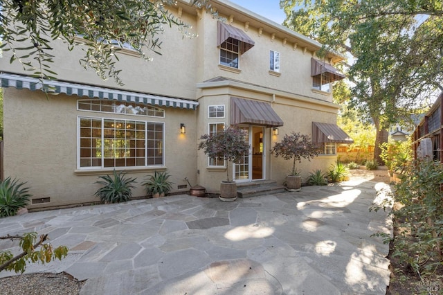 view of front of property featuring a patio