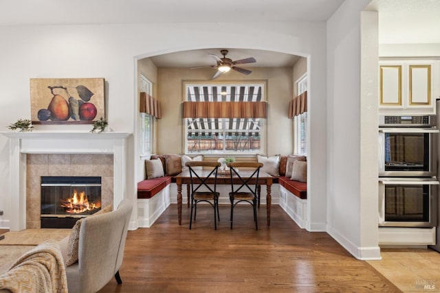 dining space with breakfast area, hardwood / wood-style floors, and a wealth of natural light