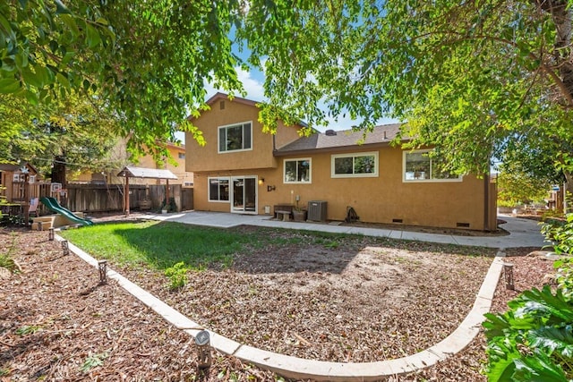 back of property featuring crawl space, a patio, fence, and stucco siding