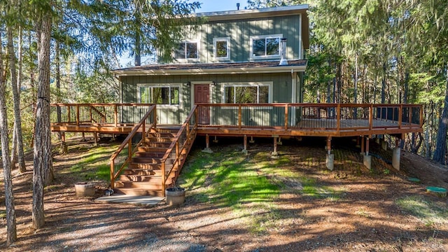 rear view of house with a wooden deck