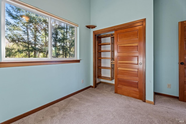 unfurnished bedroom with light carpet