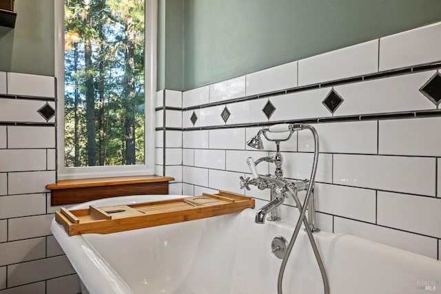 room details featuring a tub to relax in