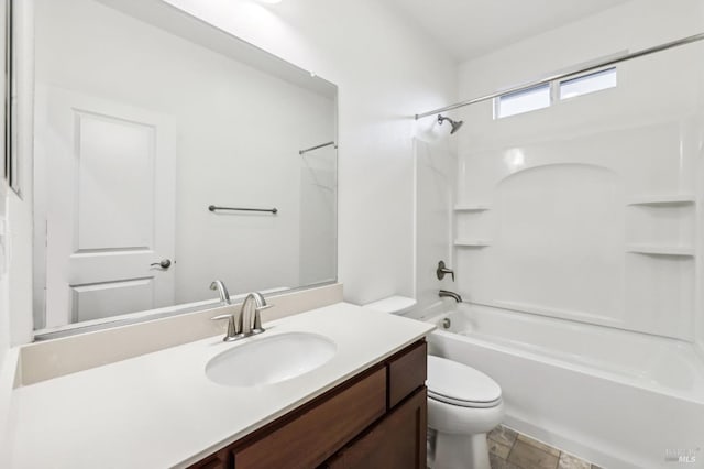 full bathroom featuring shower / bath combination, vanity, and toilet